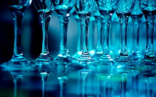 selective focus photography of clear cut long-stem champagne glasses